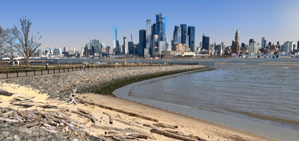 Hoboken Cove at low tide looking across the river to the Midtown skyline, with the sun low at the right edge of the frame